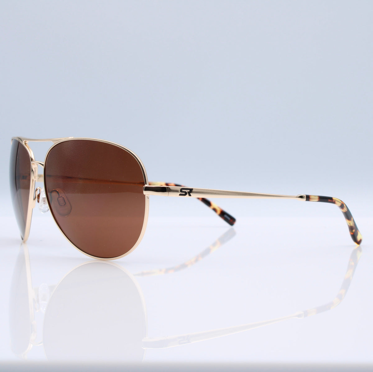 Heritage Gold Blackbird Aviator sunglasses with bronze lenses shown with SR performance case, pouch, and box.