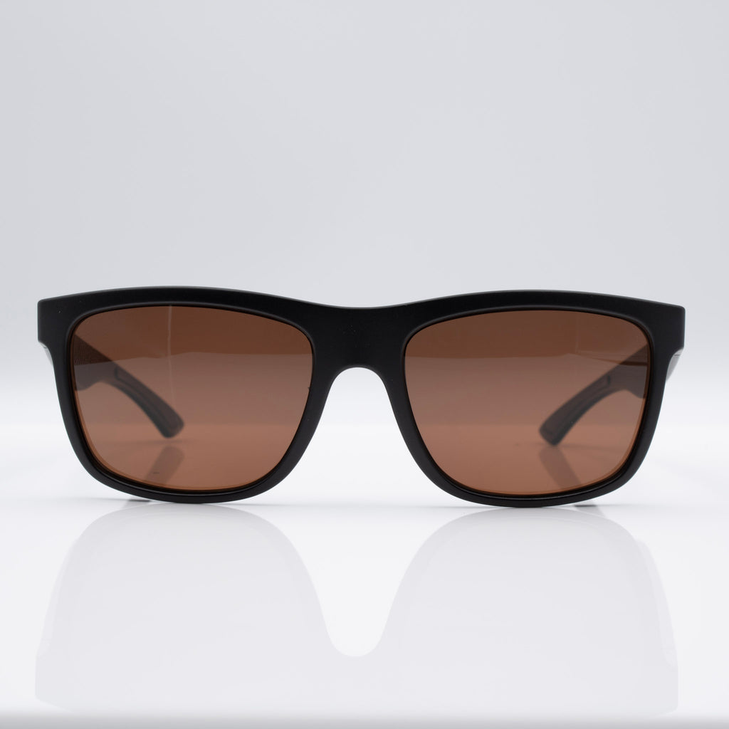 Matte Stealth Black Inverted sunglasses with bronze lenses, angled profile showing lightweight performance frame.