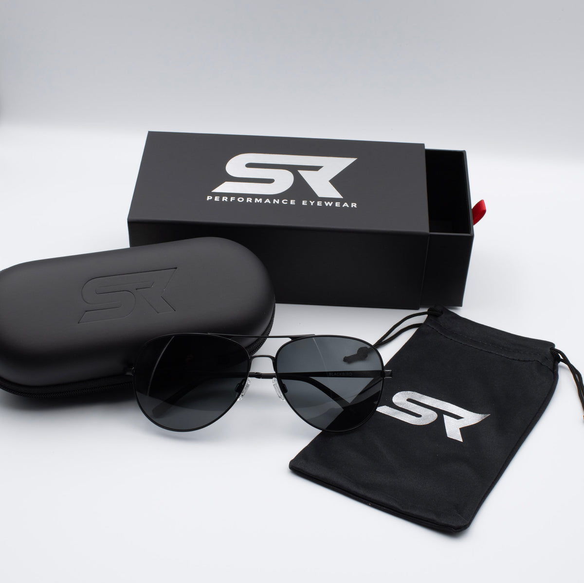 Matte Stealth Black Blackbird Aviator sunglasses with gray lenses and premium SR Performance Eyewear packaging.