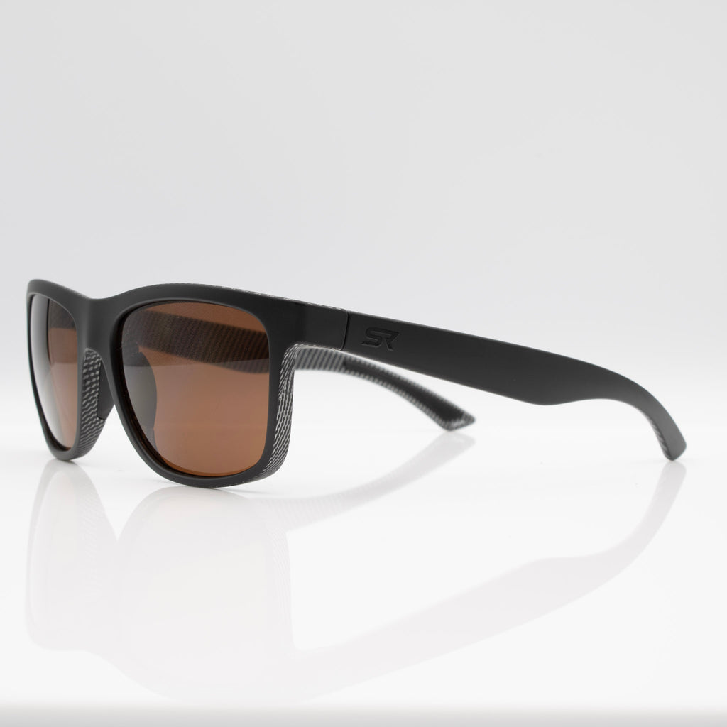 Matte Black Carbon Inverted sunglasses with bronze lenses, side profile showing performance temple design.