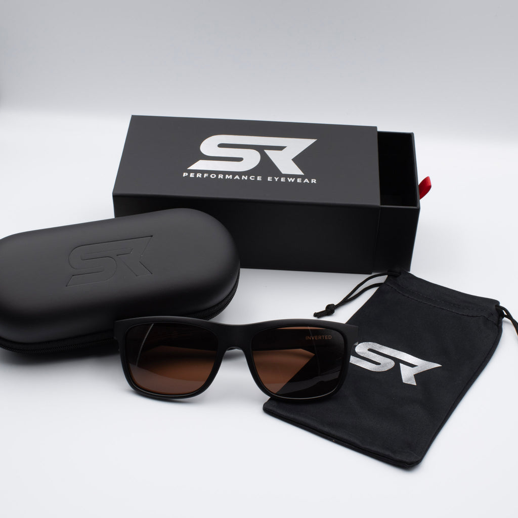 Matte Stealth Black Inverted sunglasses with bronze lenses and premium SR Performance Eyewear packaging.