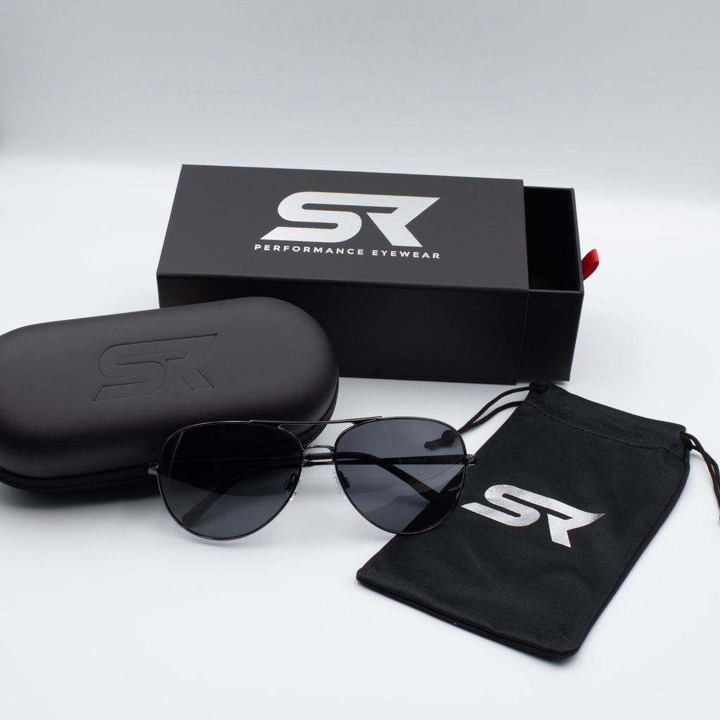 Gunmetal Blackbird Aviator sunglasses with gray lenses and premium SR Performance Eyewear packaging.