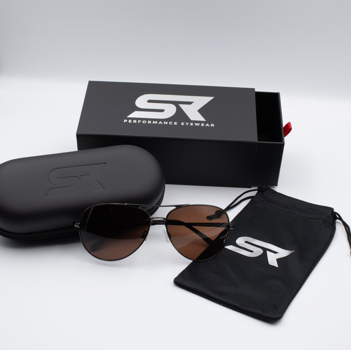 Gunmetal Blackbird Aviator sunglasses with bronze lenses and premium SR Performance Eyewear packaging.