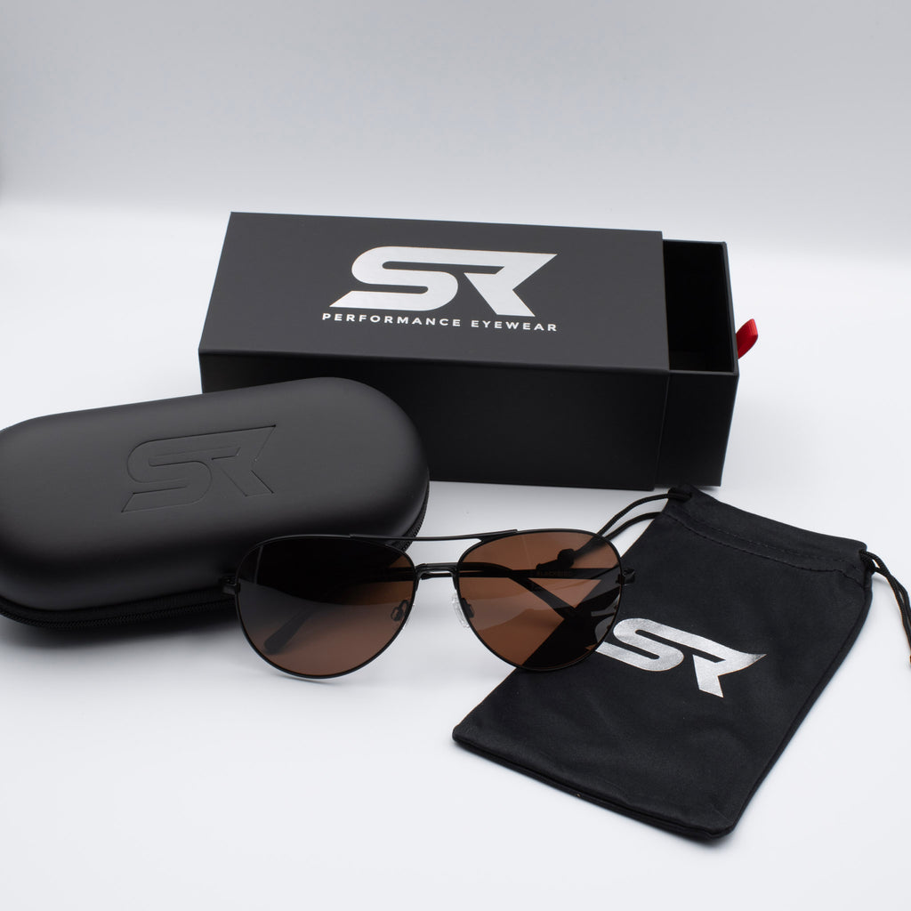 Matte Stealth Black Blackbird Aviator sunglasses with bronze lenses and premium SR Performance Eyewear packaging.