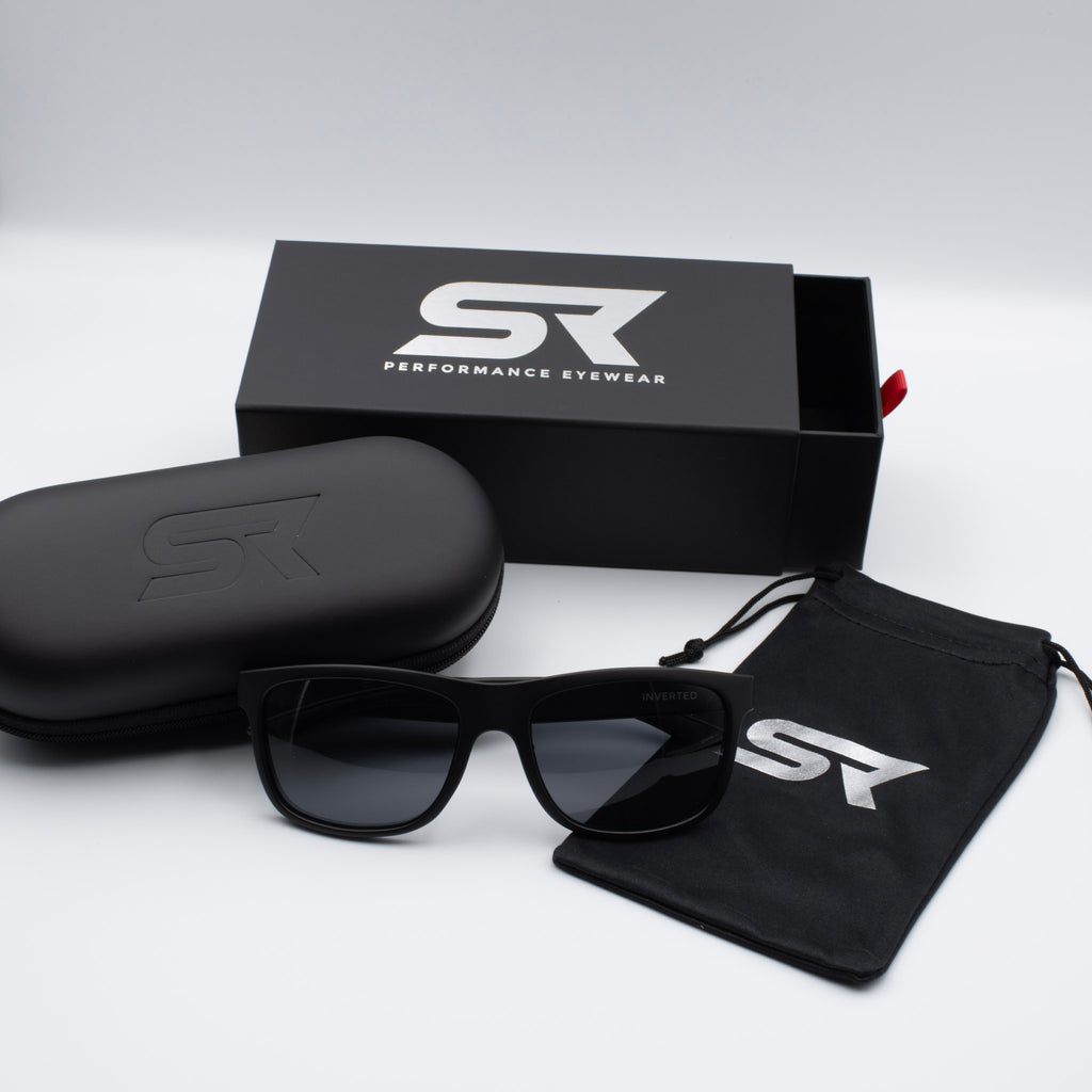Matte Stealth Black Inverted sunglasses with gray lenses and premium SR Performance Eyewear packaging.