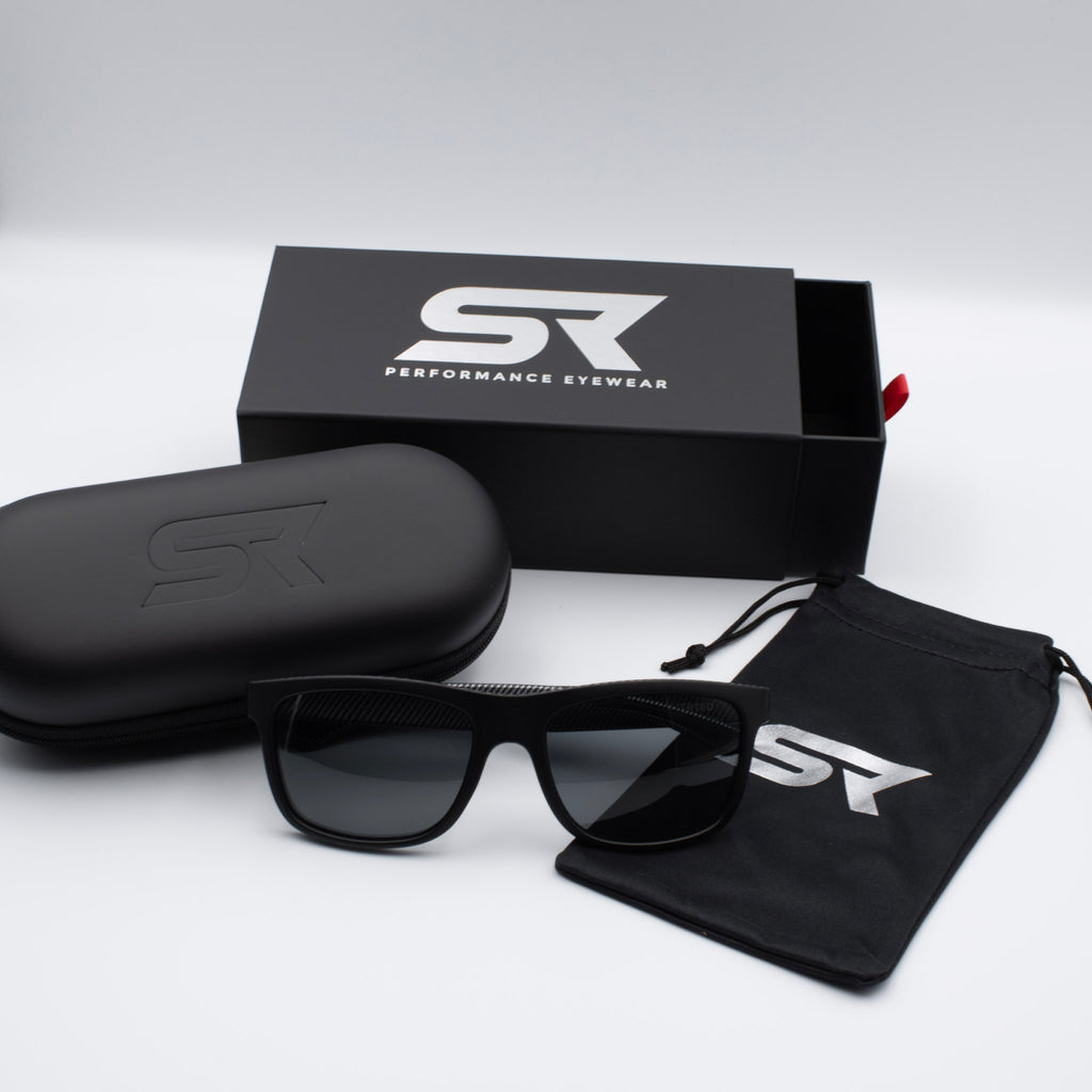 Matte Black Carbon Inverted sunglasses with gray lenses and premium SR Performance Eyewear packaging.