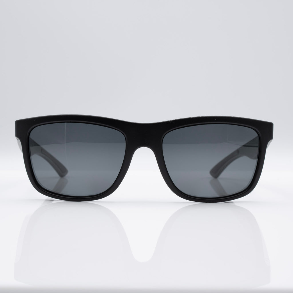 Inverted Blackout Edition sunglasses in Matte Black Carbon with gray CEVART polycarbonate lenses, clean front view.