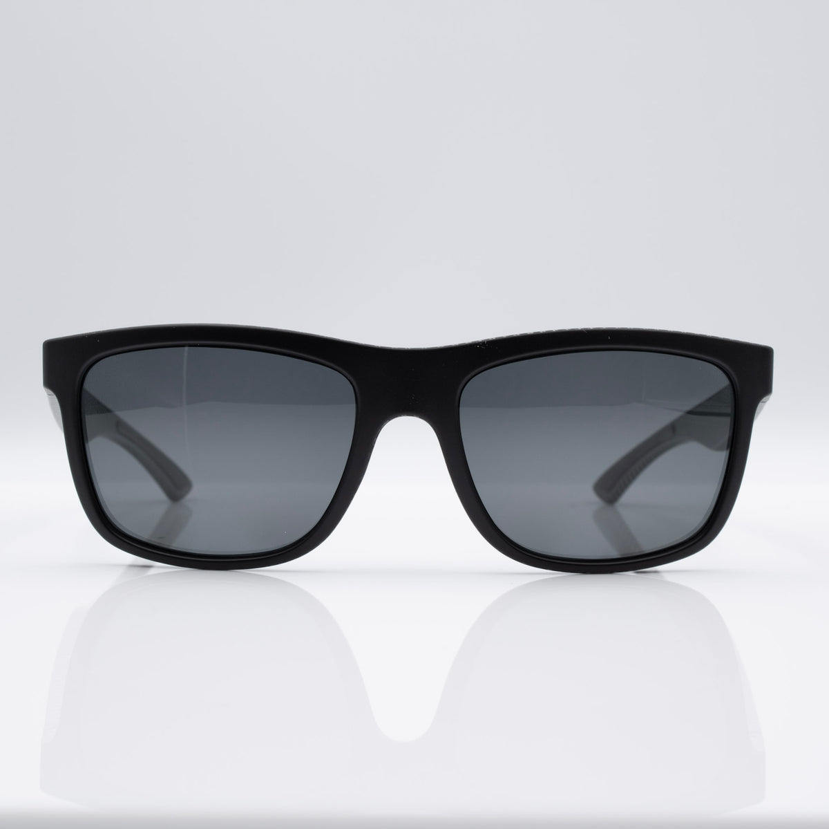 Inverted Blackout Edition sunglasses in Matte Black Carbon with gray CEVART polycarbonate lenses, clean front view.