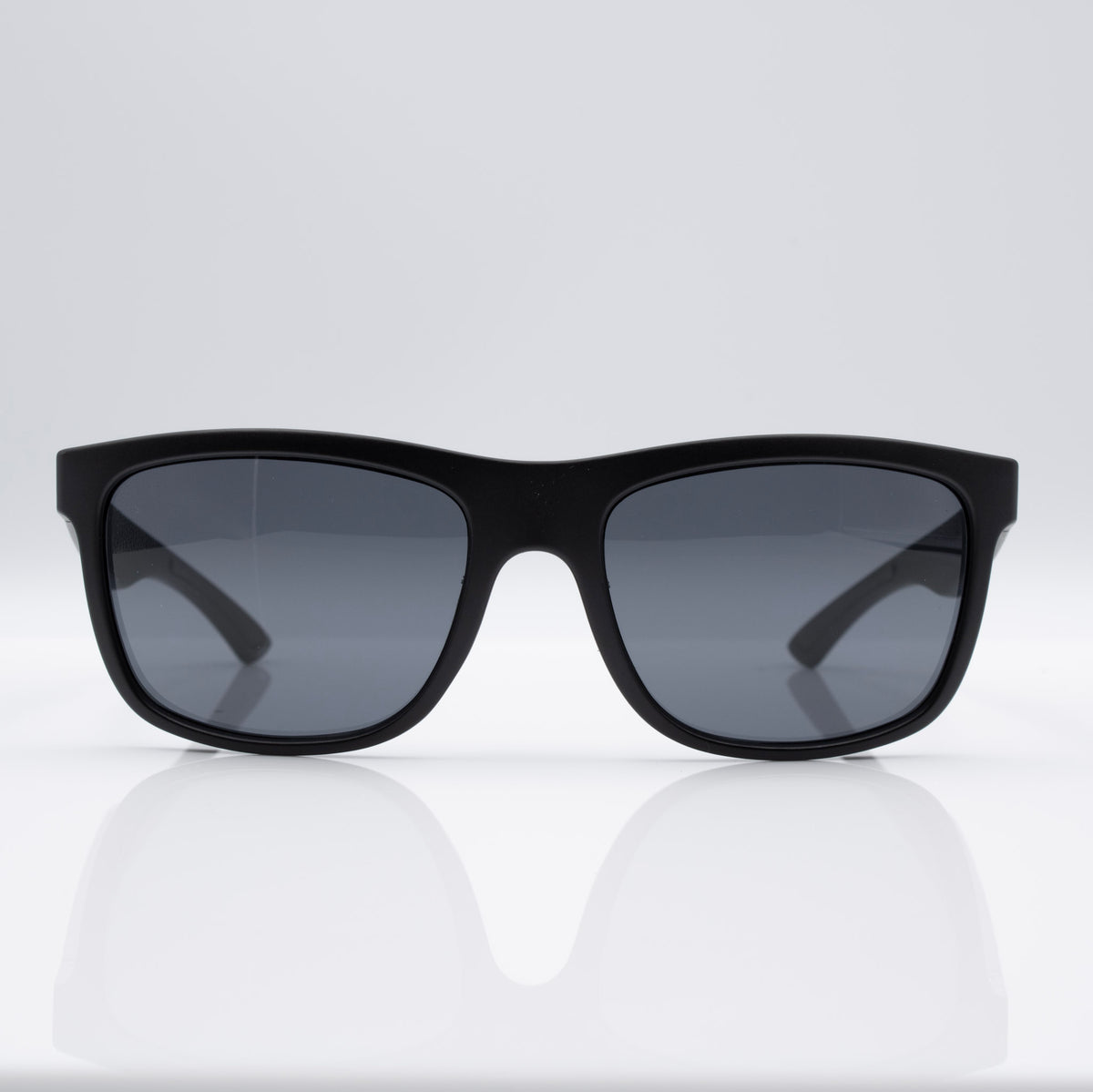 Inverted Blackout Edition sunglasses in Matte Stealth Black with gray CEVART polycarbonate lenses, clean front view.