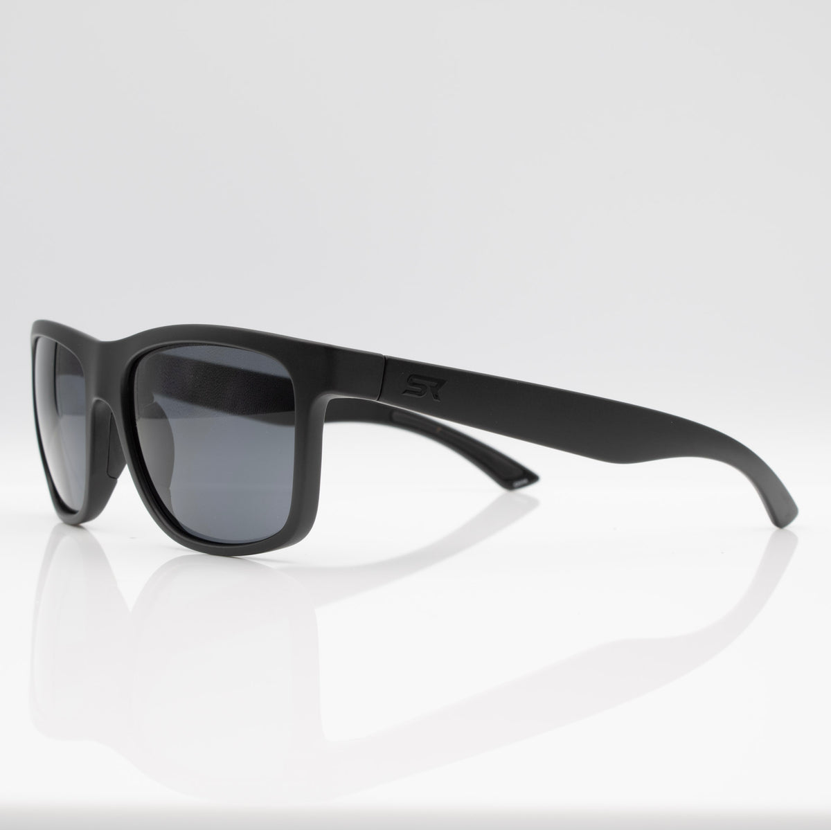 Matte Stealth Black Inverted sunglasses with gray lenses, angled profile showing slim performance temples.