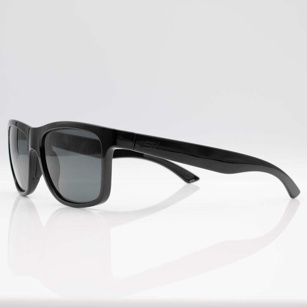 Stealth Gloss Black Inverted sunglasses with gray lenses, angled profile showing glossy blackout frame.